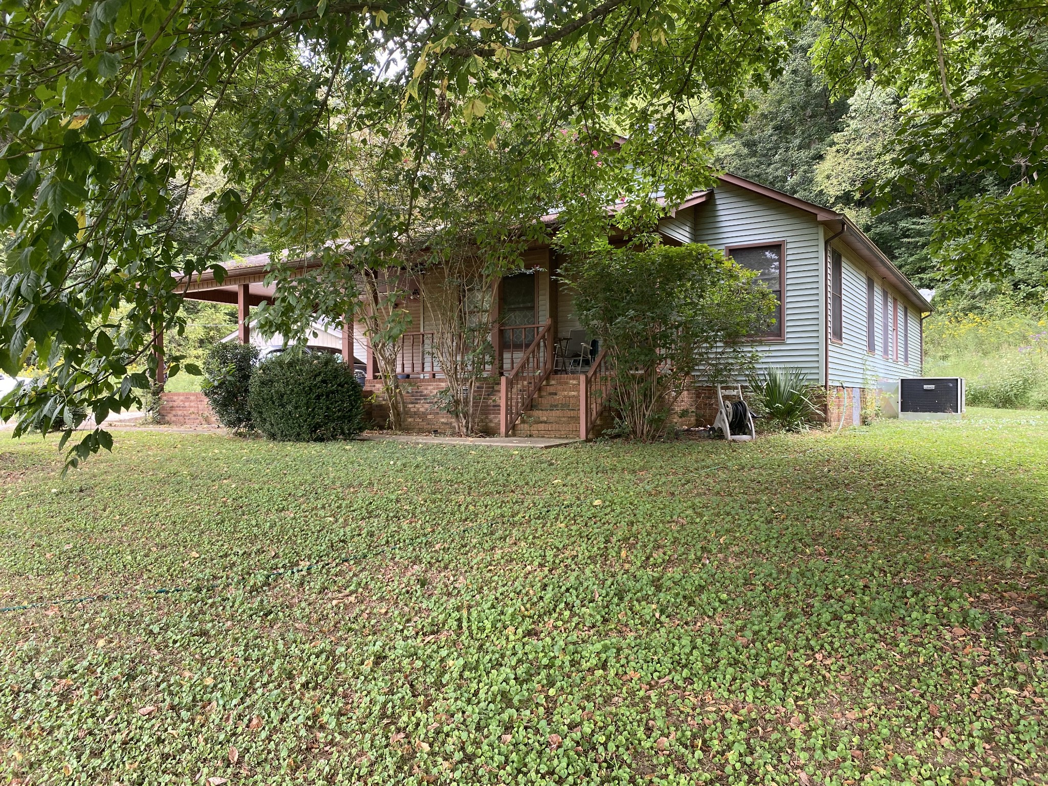 201 Young Hollow Road Pulaski, TN 38478 - Photo 15 of 24 a front view of a house with garden