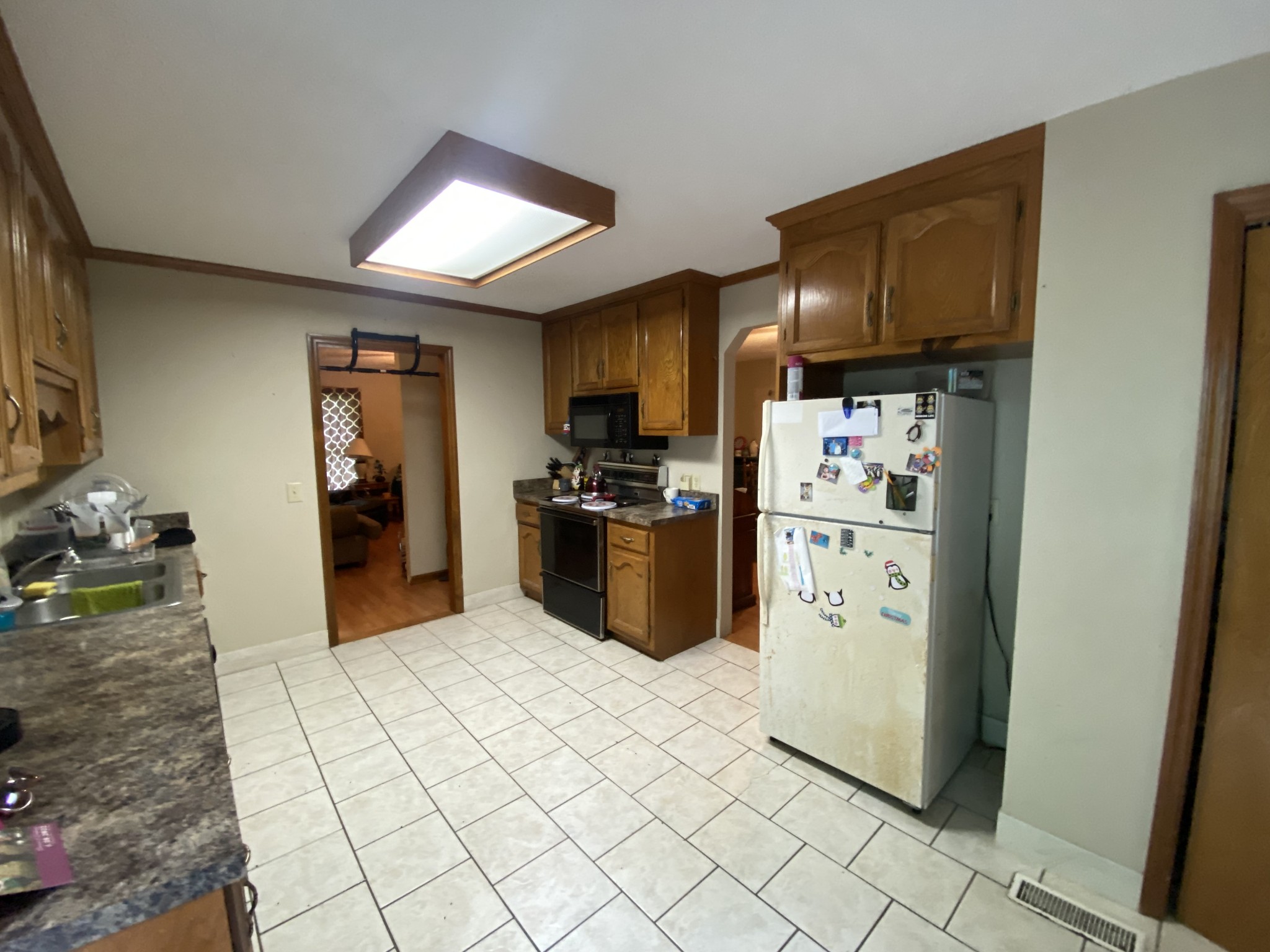 201 Young Hollow Road Pulaski, TN 38478 - Photo 5 of 24 a kitchen with stainless steel appliances granite countertop a refrigerator sink and cabinets