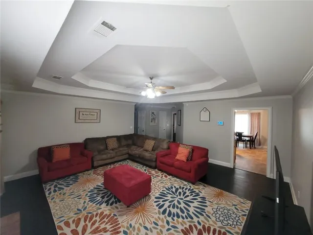 a living room with furniture and a rug