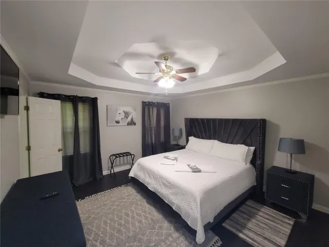 a bedroom with a bed and a table