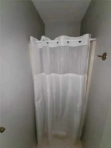 a bathroom with a bathtub and shower