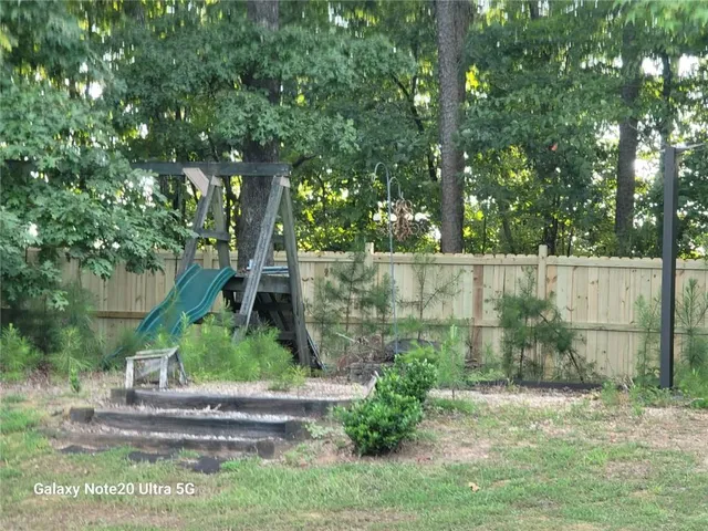 a backyard of a house with lots of green space
