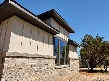 a view of an empty room with a large window