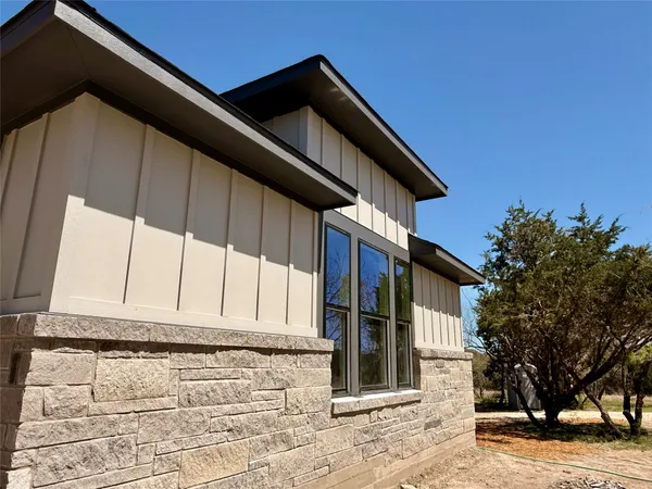 a view of an empty room with a large window
