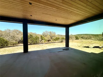 a bathroom with a sink mirror and a toilet