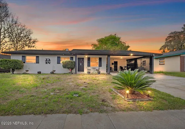 front view of a house with a yard