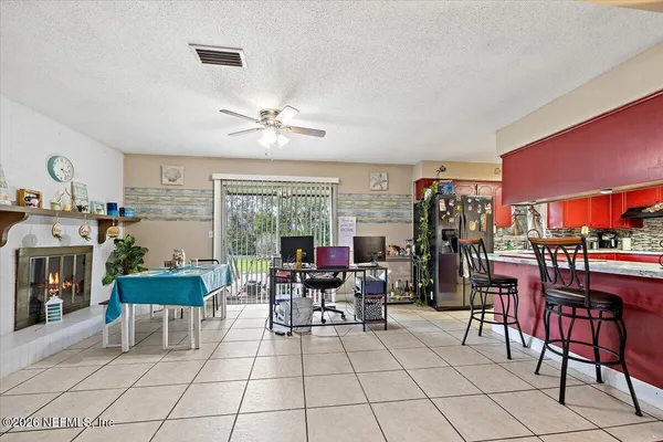a living room with lots of furniture and white walls