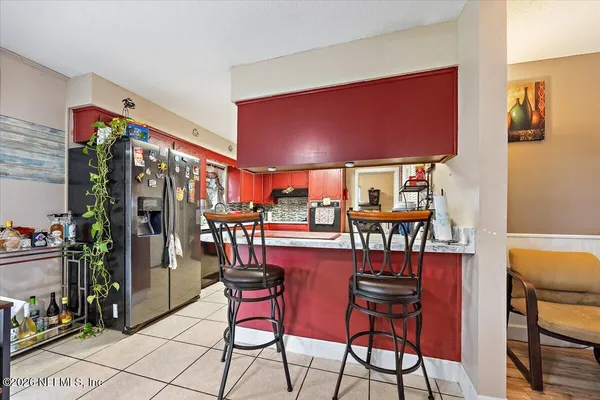 a dining room with furniture and a chandelier