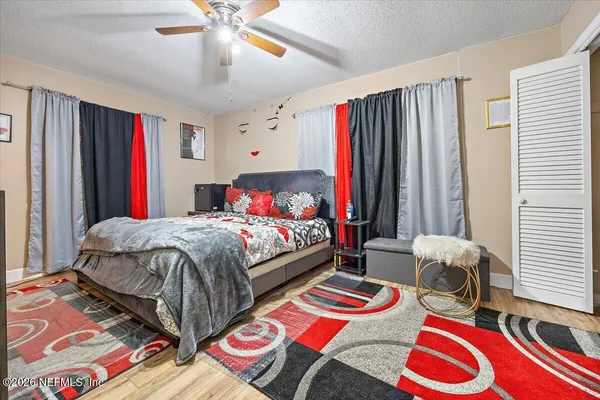 a bedroom with bed and a window