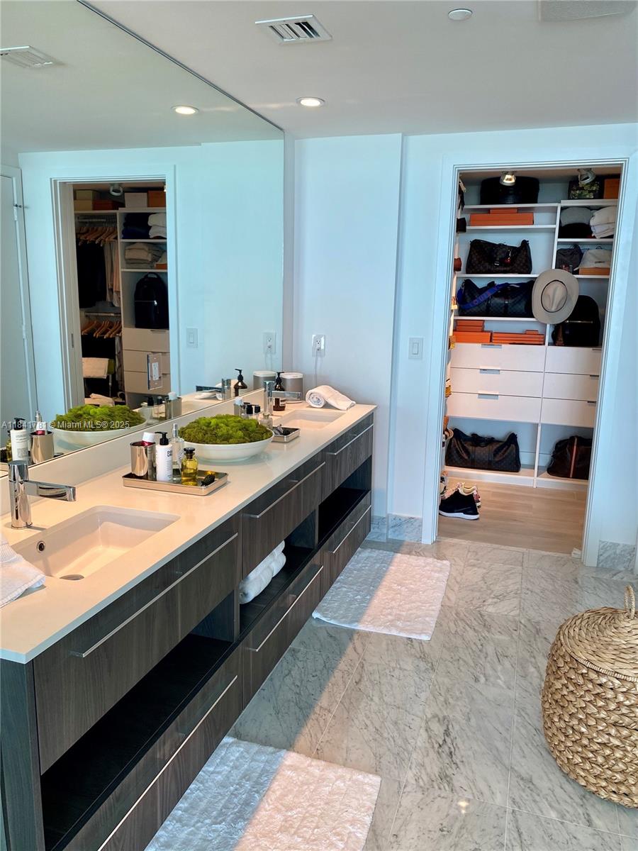 3131 Northeast 7th Avenue, Unit 2801 Miami, FL 33137 - Photo 16 of 47 a spacious bathroom with double vanity and a double vanity sink