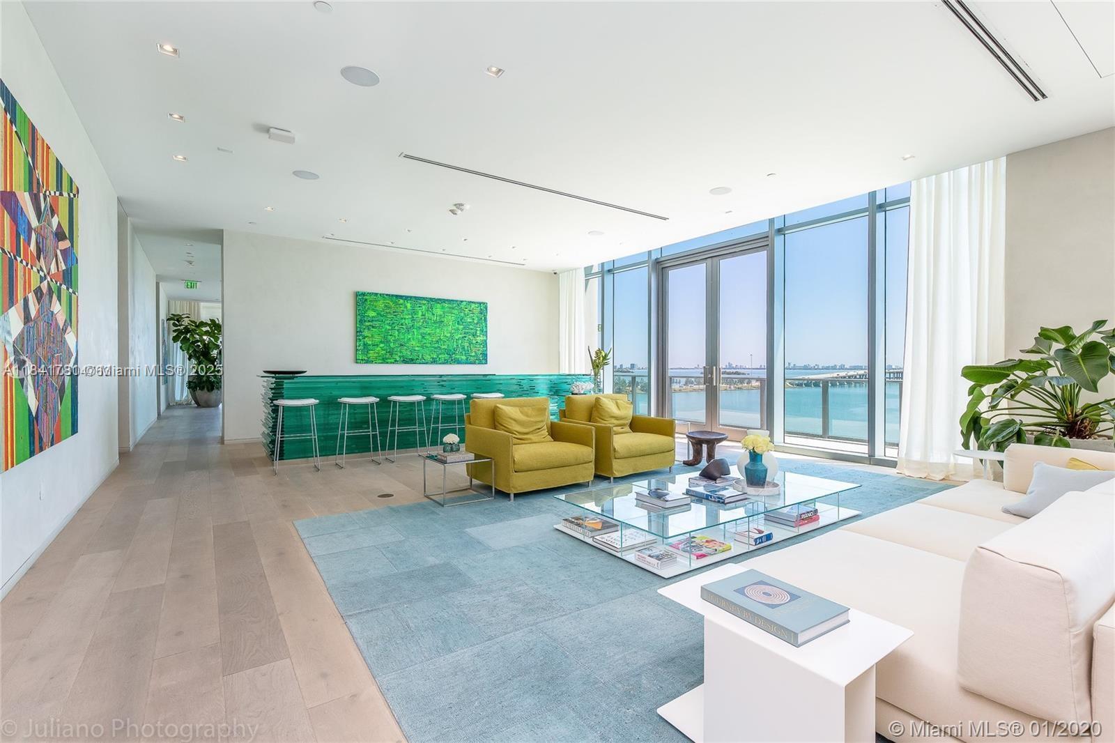 3131 Northeast 7th Avenue, Unit 2801 Miami, FL 33137 - Photo 44 of 47 a spacious bedroom with a bed and a large window