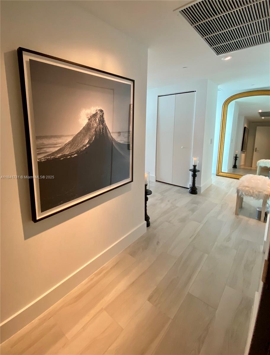 3131 Northeast 7th Avenue, Unit 2801 Miami, FL 33137 - Photo 8 of 47 a view of a room with a large mirror of a house