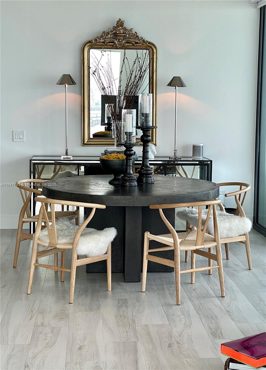 3131 Northeast 7th Avenue, Unit 2801 Miami, FL 33137 - Photo 9 of 47 a view of a kitchen counter space and chairs