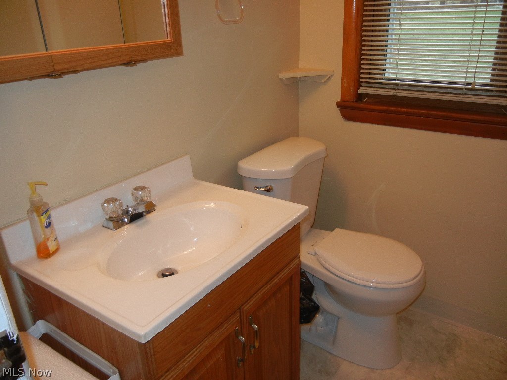 1189 Oakes Road Broadview Heights, OH 44147 - Photo 8 of 19 Half bath with brand new floor, conveniently located off the kitchen and garage!