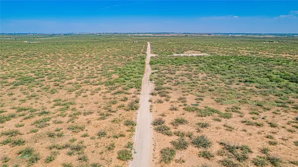 a view of a wooden floor with a bench