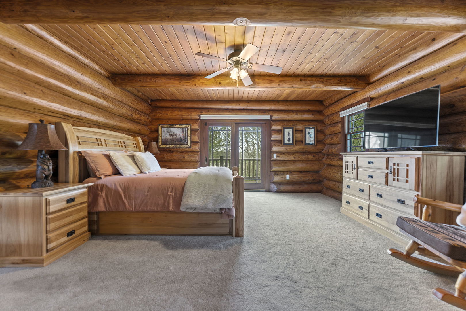 3317 South Country Club Road Woodstock, IL 60098 - Photo 16 of 43 a bedroom with furniture and a flat screen tv