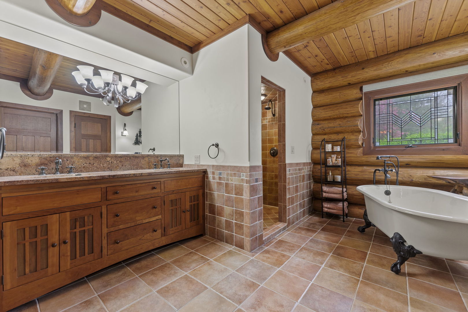 3317 South Country Club Road Woodstock, IL 60098 - Photo 17 of 43 a spacious bathroom with a double vanity sink a mirror and a bathtub