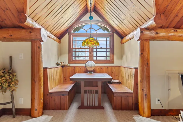 a view of living room with furniture and a potted plant
