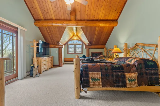 a bedroom with bed and window