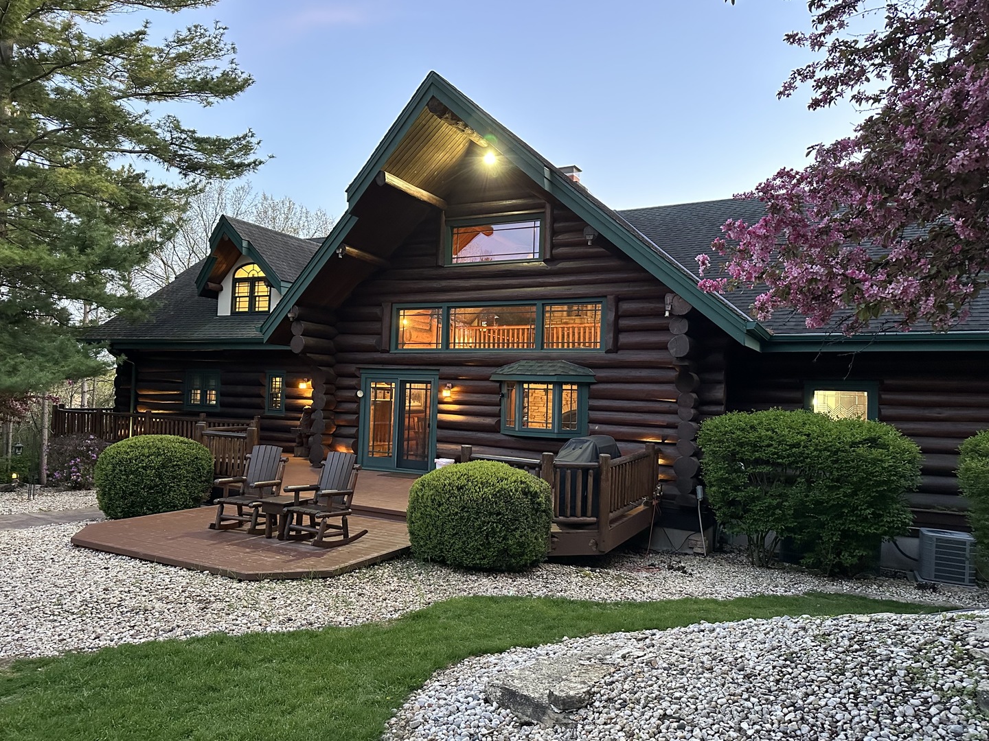 3317 South Country Club Road Woodstock, IL 60098 - Photo 2 of 43 a front view of a house with garden
