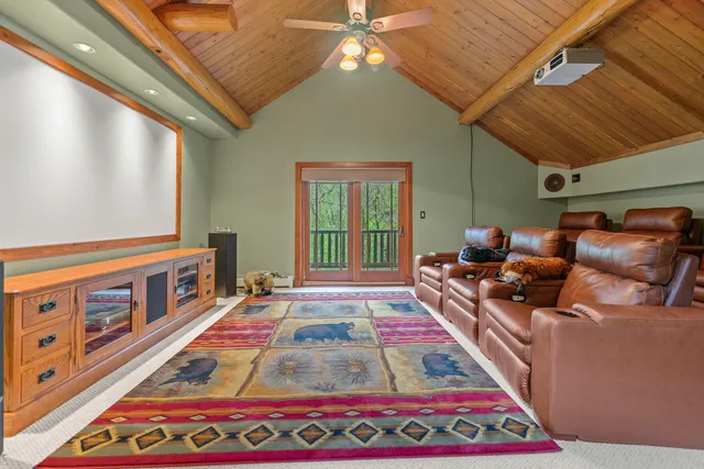 a bed sitting in a room next to a rug