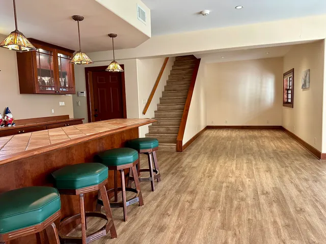 a dining room with furniture and window