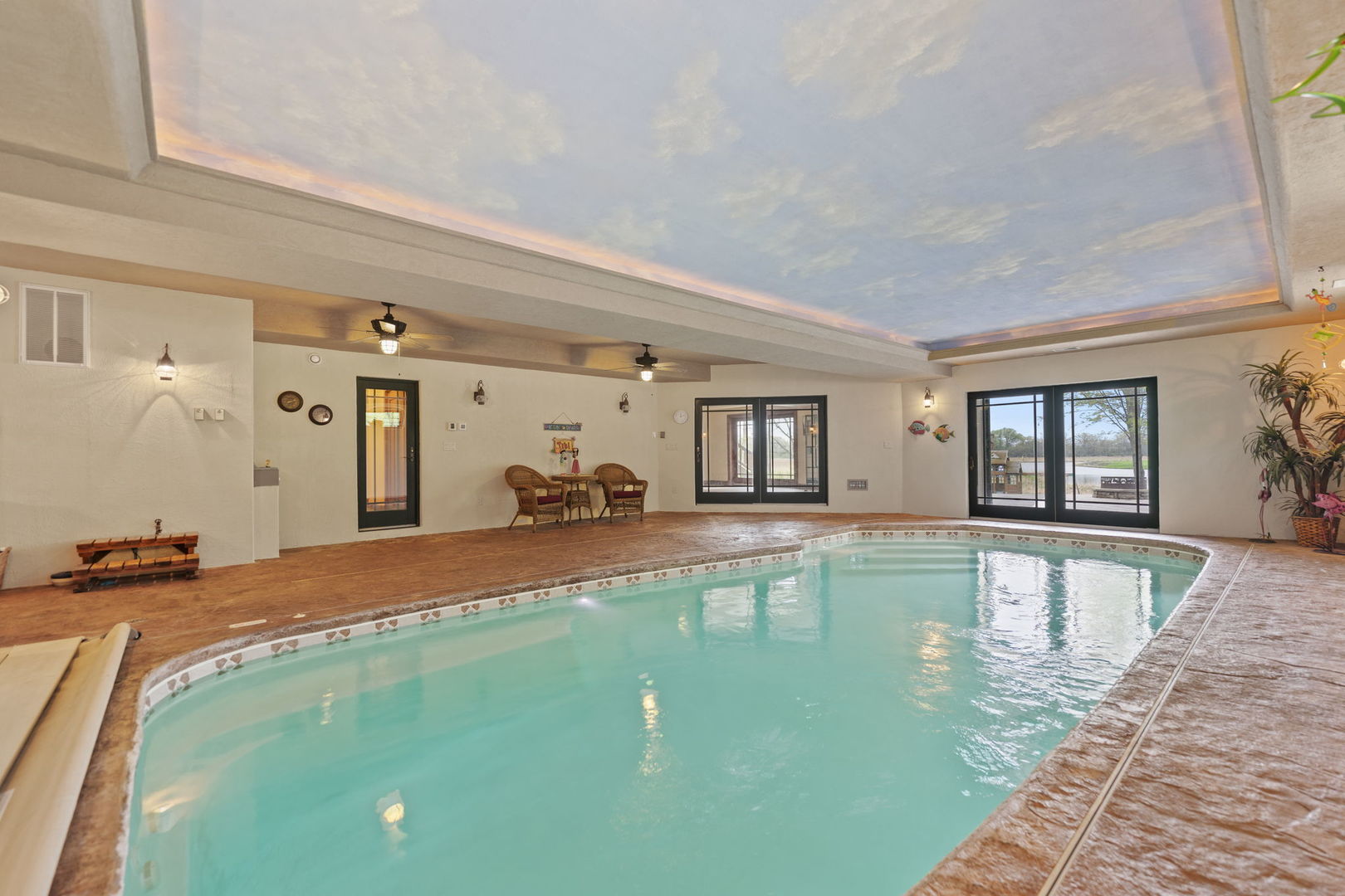 3317 South Country Club Road Woodstock, IL 60098 - Photo 26 of 43 a bed room with a bed and a view of living room