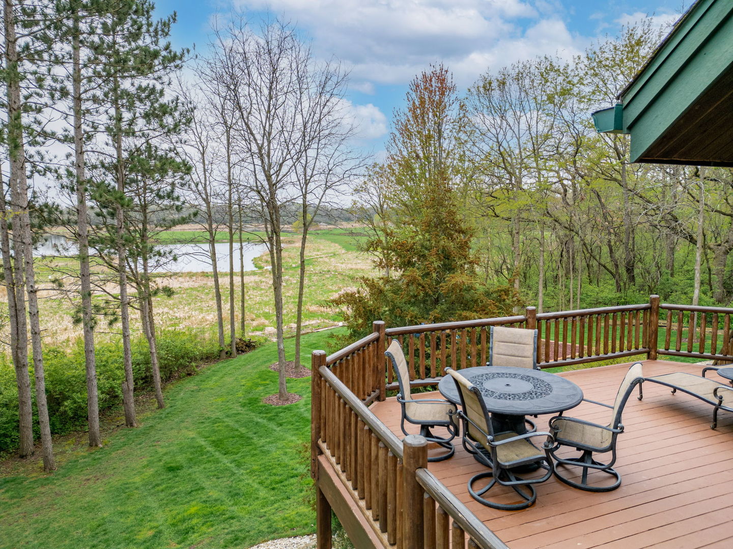 3317 South Country Club Road Woodstock, IL 60098 - Photo 29 of 43 a view of balcony with furniture and wooden deck