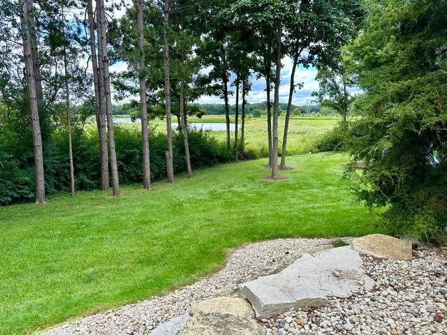 a view of a lake with a yard