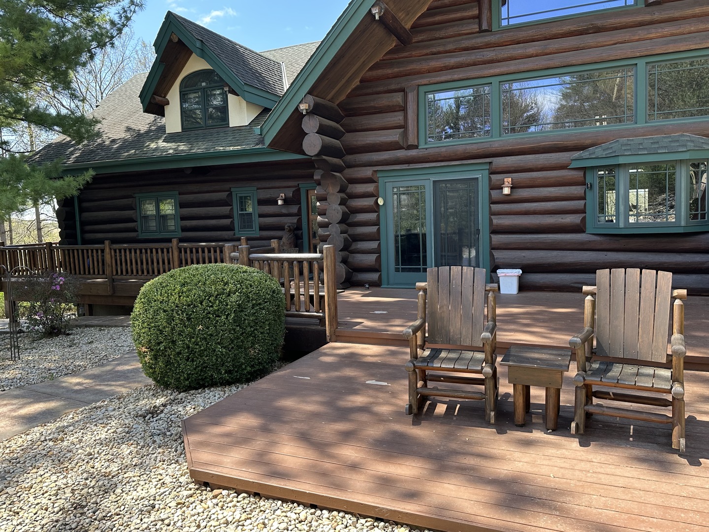 3317 South Country Club Road Woodstock, IL 60098 - Photo 35 of 43 a view of a house with a balcony and parking space