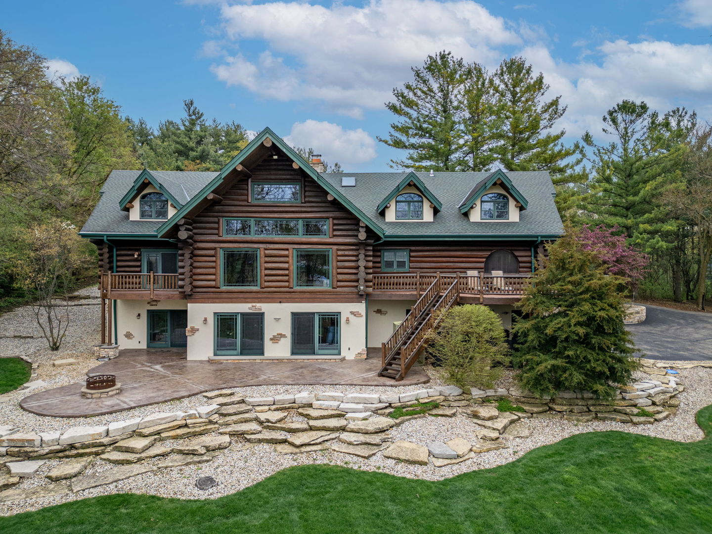 3317 South Country Club Road Woodstock, IL 60098 - Photo 4 of 43 a front view of a house with a yard