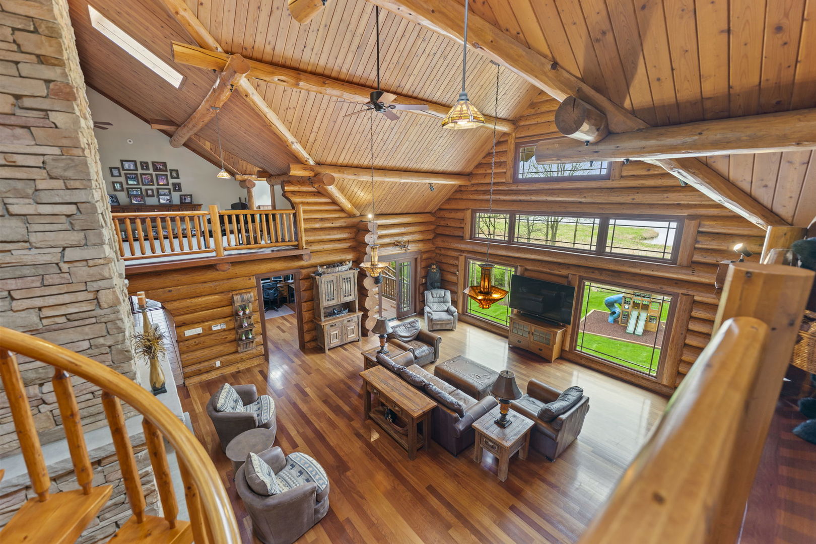 3317 South Country Club Road Woodstock, IL 60098 - Photo 5 of 43 a living room with furniture and a wooden floor