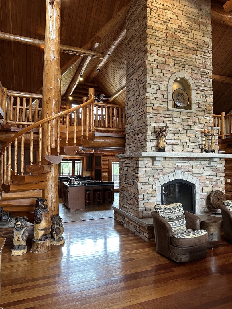 3317 South Country Club Road Woodstock, IL 60098 - Photo 8 of 43 a living room with furniture and a fireplace
