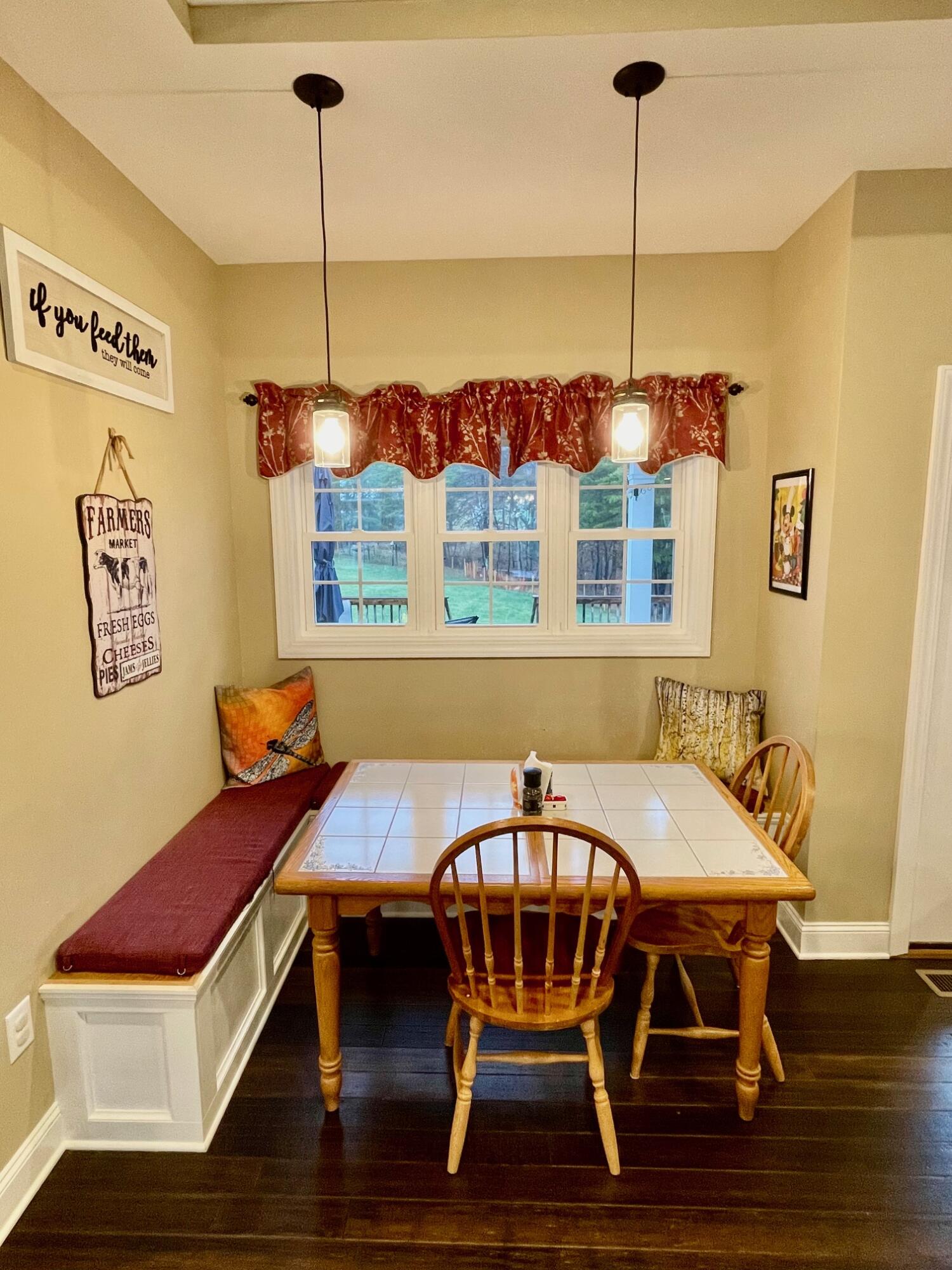 64 Hickory Ridge Court Blue Ridge, VA 24064 - Photo 20 of 61 a view of a dining room with furniture wooden floor and chandelier