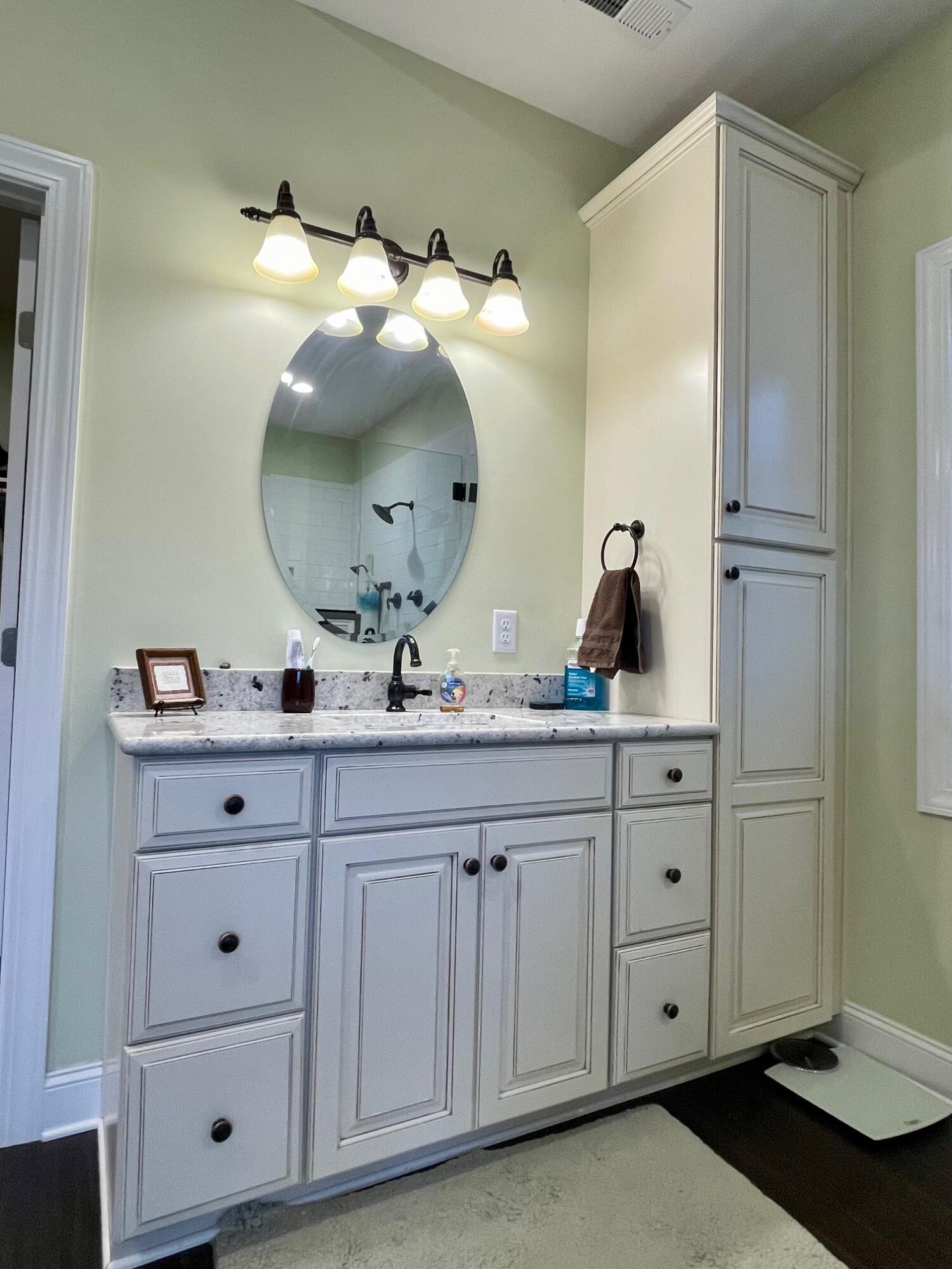 64 Hickory Ridge Court Blue Ridge, VA 24064 - Photo 31 of 61 a bathroom with a double vanity sink and mirror