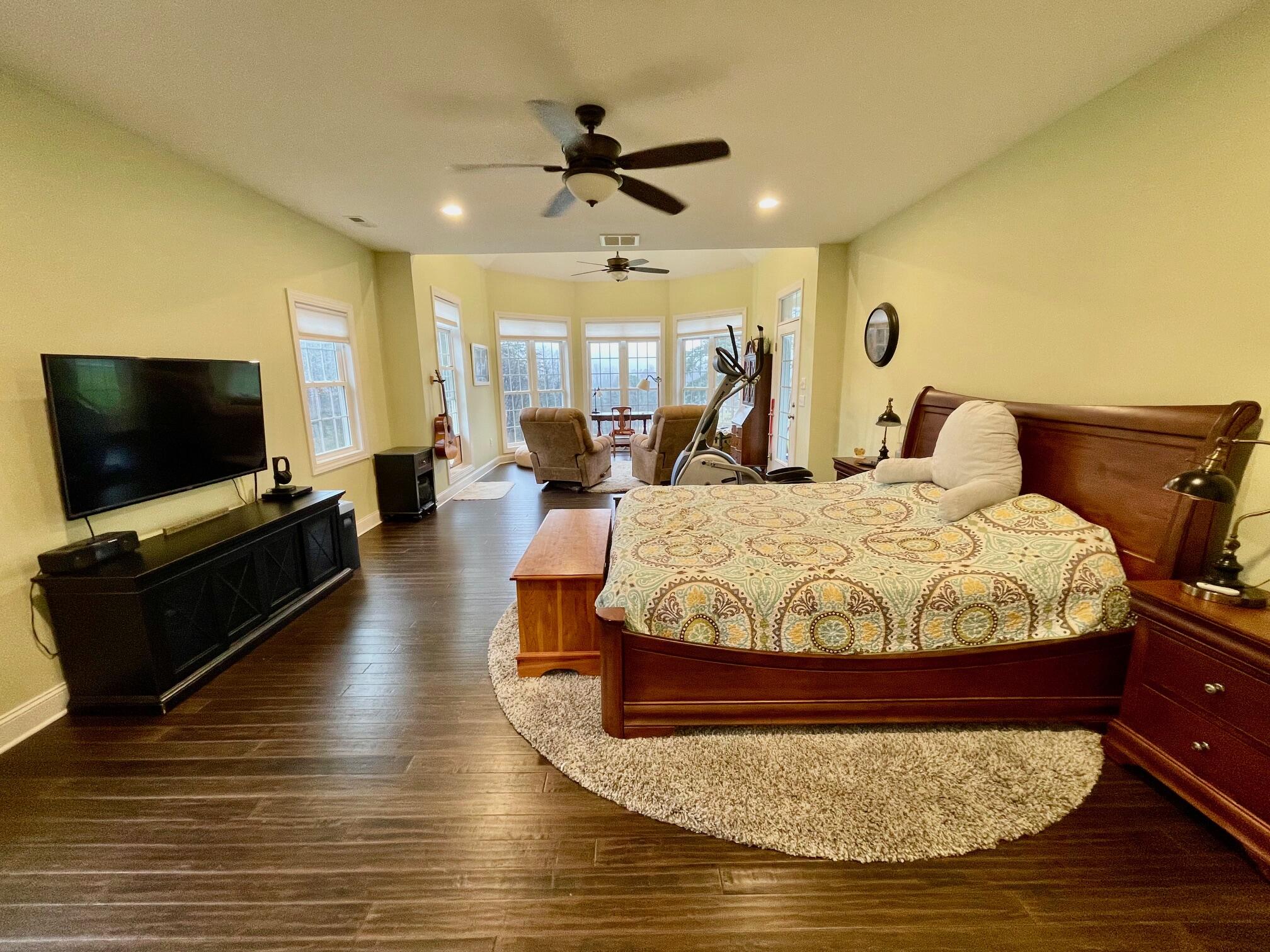 64 Hickory Ridge Court Blue Ridge, VA 24064 - Photo 35 of 61 a spacious bedroom with a bed and a flat screen tv
