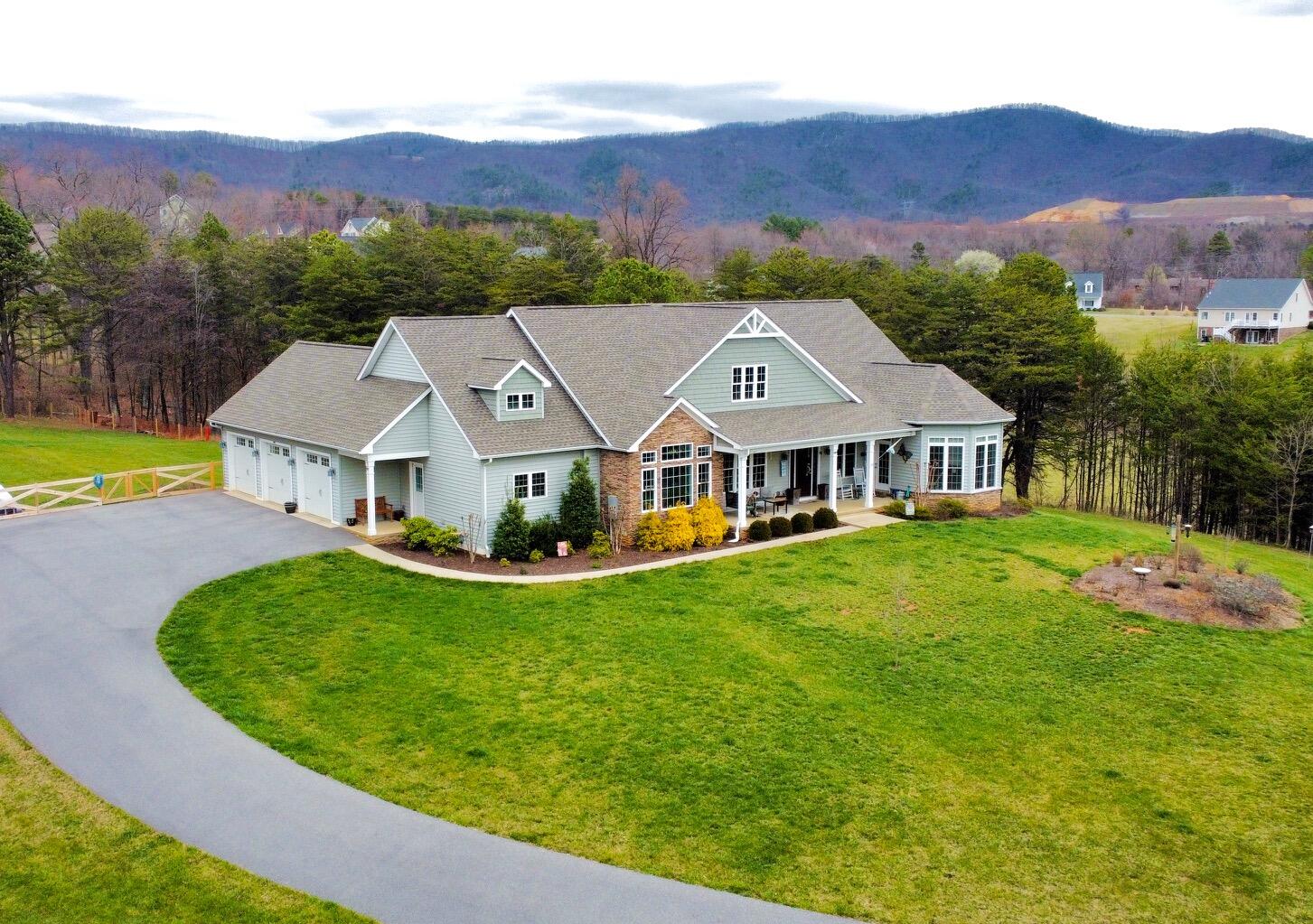 64 Hickory Ridge Court Blue Ridge, VA 24064 - Photo 54 of 61 a view of a house with garden and a mountain view