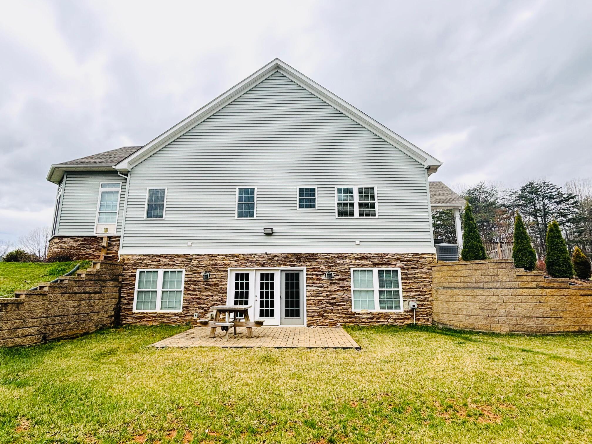 64 Hickory Ridge Court Blue Ridge, VA 24064 - Photo 6 of 61 a front view of a house with a yard