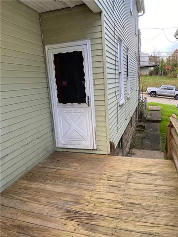 a view of a porch with a bench