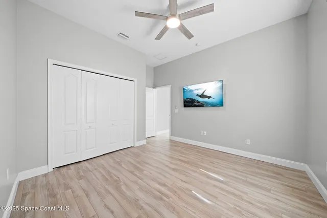 a bathroom with a double vanity sink toilet and shower