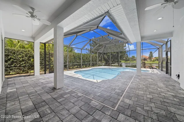 a kitchen with a sink cabinets and a window