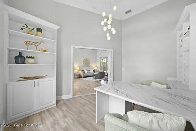 a spacious bathroom with a granite countertop sink a mirror and vanity