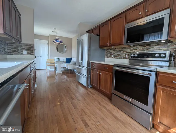a view of a living room and dining room