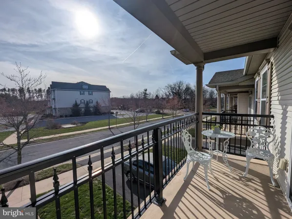 a spacious bedroom with a bed and a dresser