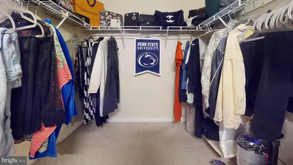a bathroom with a double vanity sink toilet and a mirror