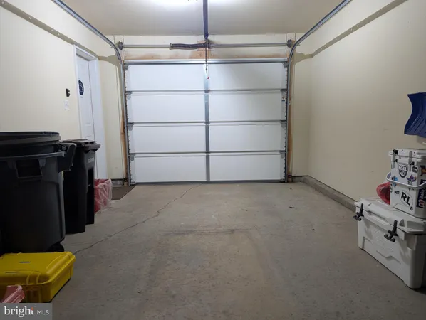 a front view of a building with a yard