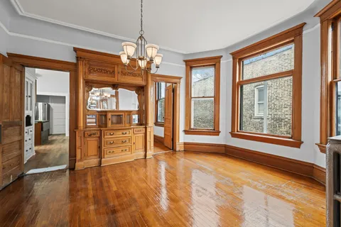 a view of a room with window and wooden floor