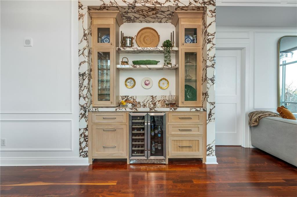 905 Juniper Street Northeast, Unit 705 Atlanta, GA 30309 - Photo 12 of 62 a view of kitchen cabinets and wooden floor