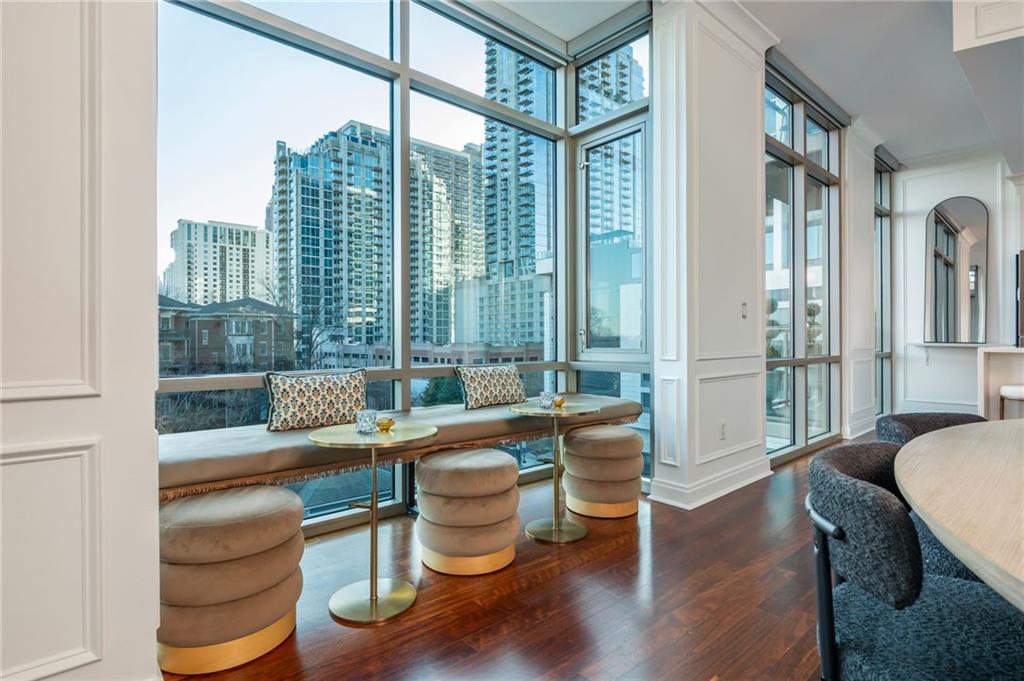 905 Juniper Street Northeast, Unit 705 Atlanta, GA 30309 - Photo 16 of 62 a living room with furniture and a window