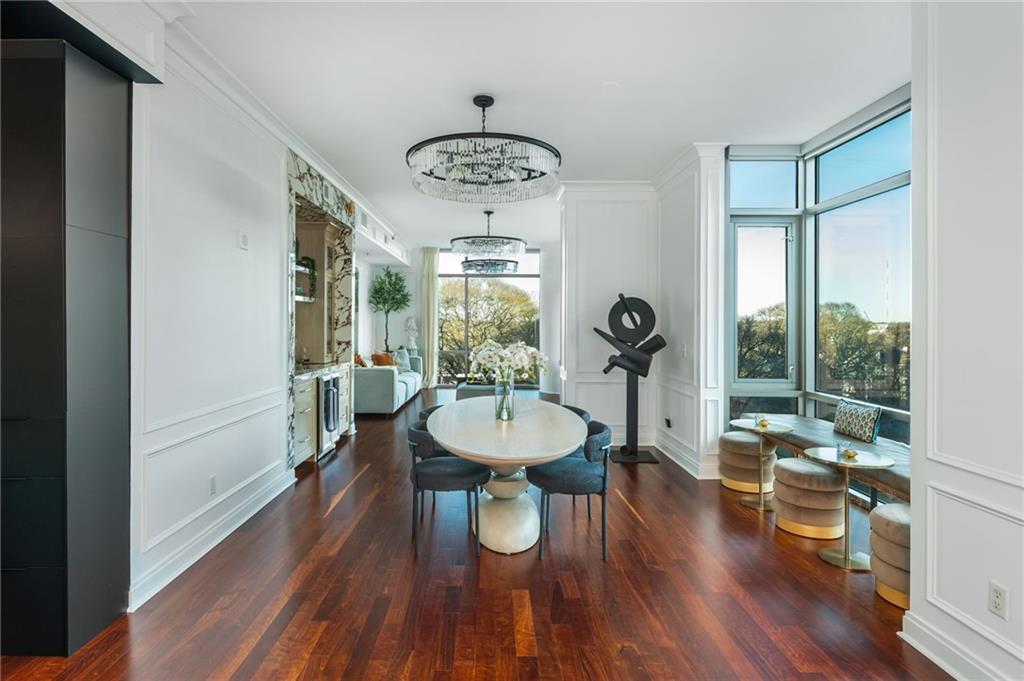 905 Juniper Street Northeast, Unit 705 Atlanta, GA 30309 - Photo 17 of 62 a view of a dining room with furniture window and wooden floor
